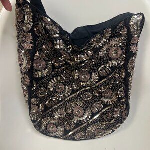 India Sequined hobo bag with amber glass bead tassels